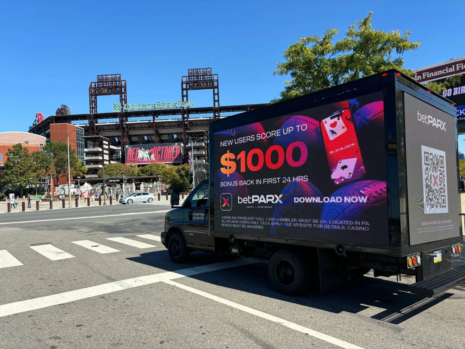 A Brandwagon LED billboard truck running a betPARX ad outside Citizens Bank Park